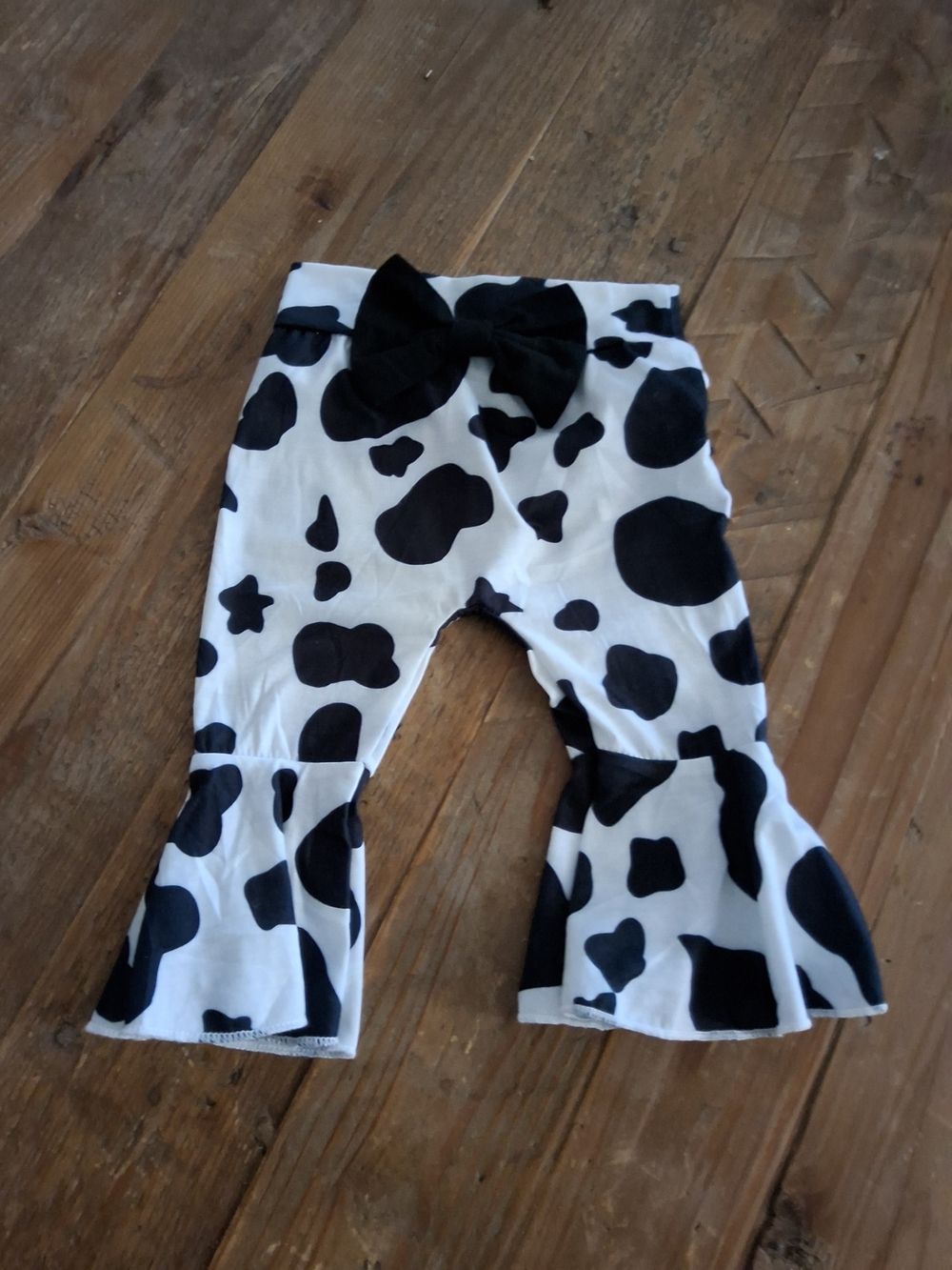 Black & White Cow-Print Flared Leggings with Bow